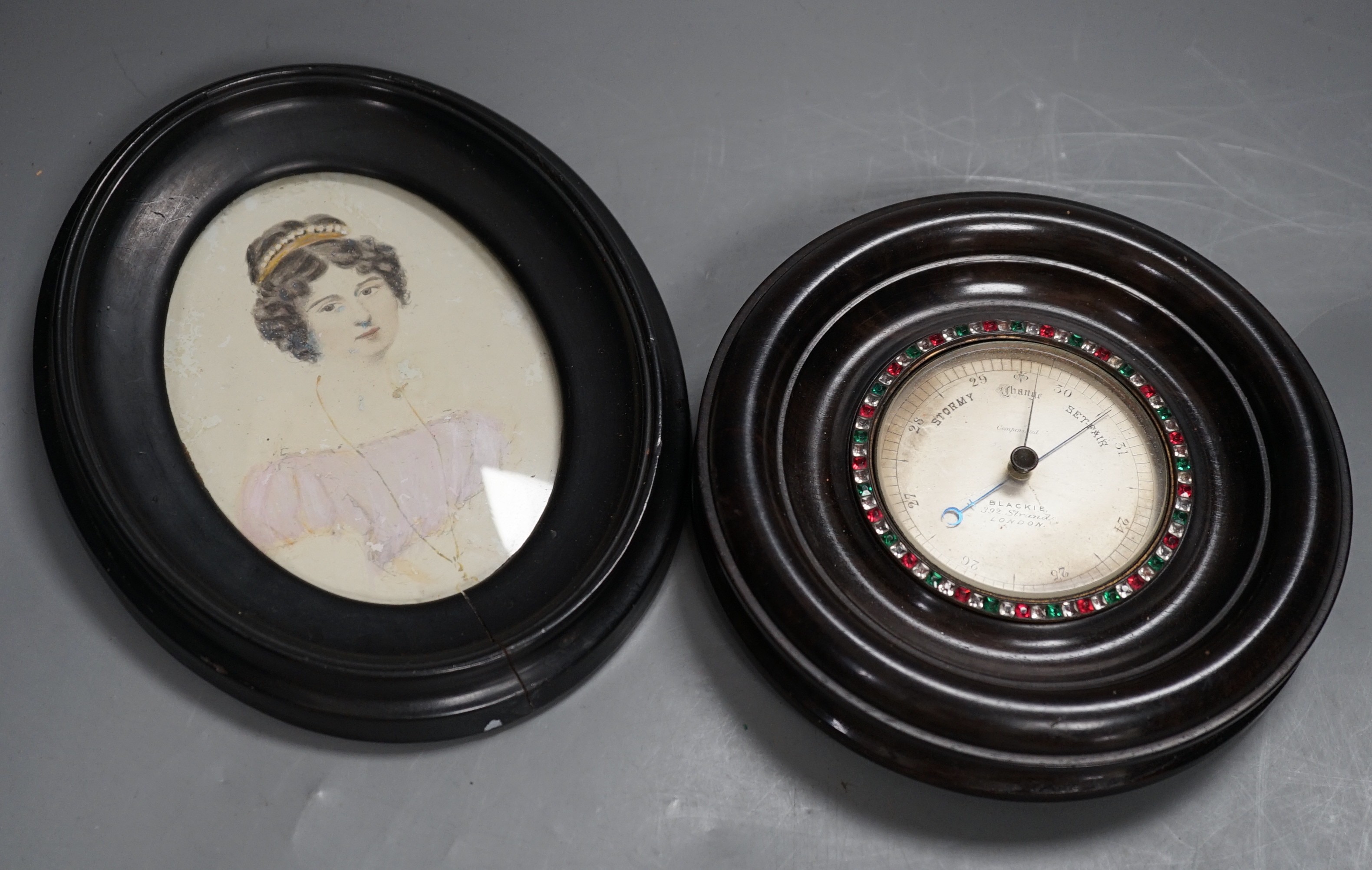 An early 19th century portrait miniature of a young lady, 12 x 9cm, together with a Blackie, 392, Strand, London small aneroid barometer with paste set bezel